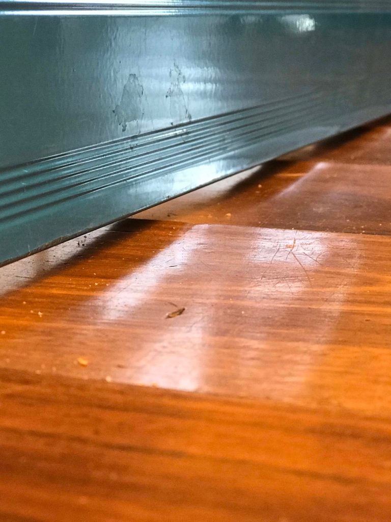 Closeup of damaged floorboards