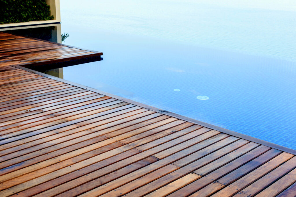 A wooden deck next to a body of water