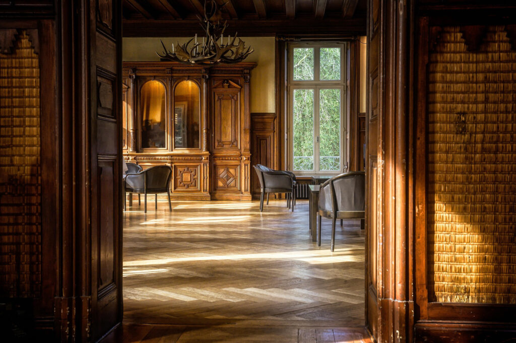 Cosy room with aged wooden furniture and floor