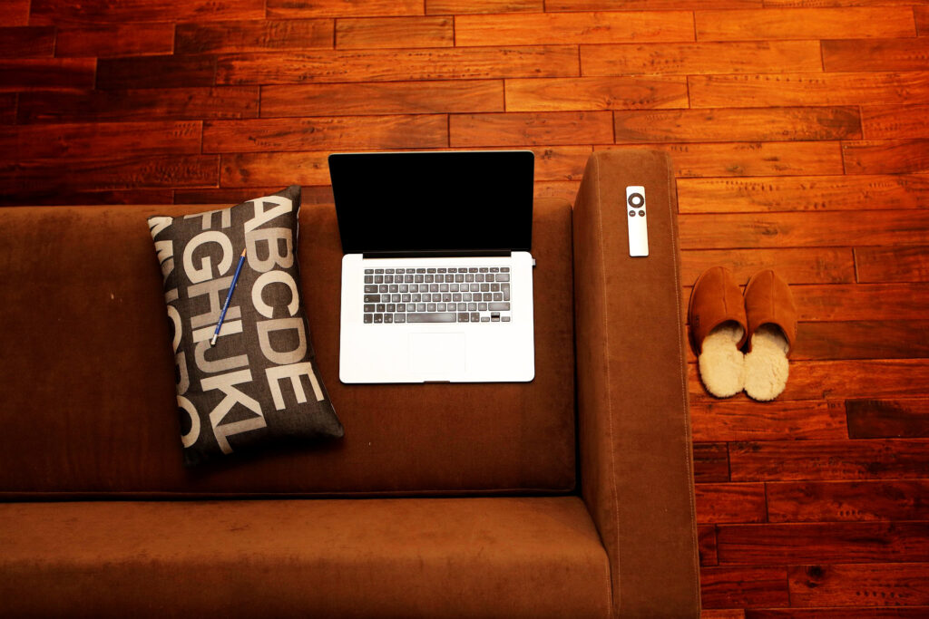 Terracotta fabric sofa blending with jarrah floors
